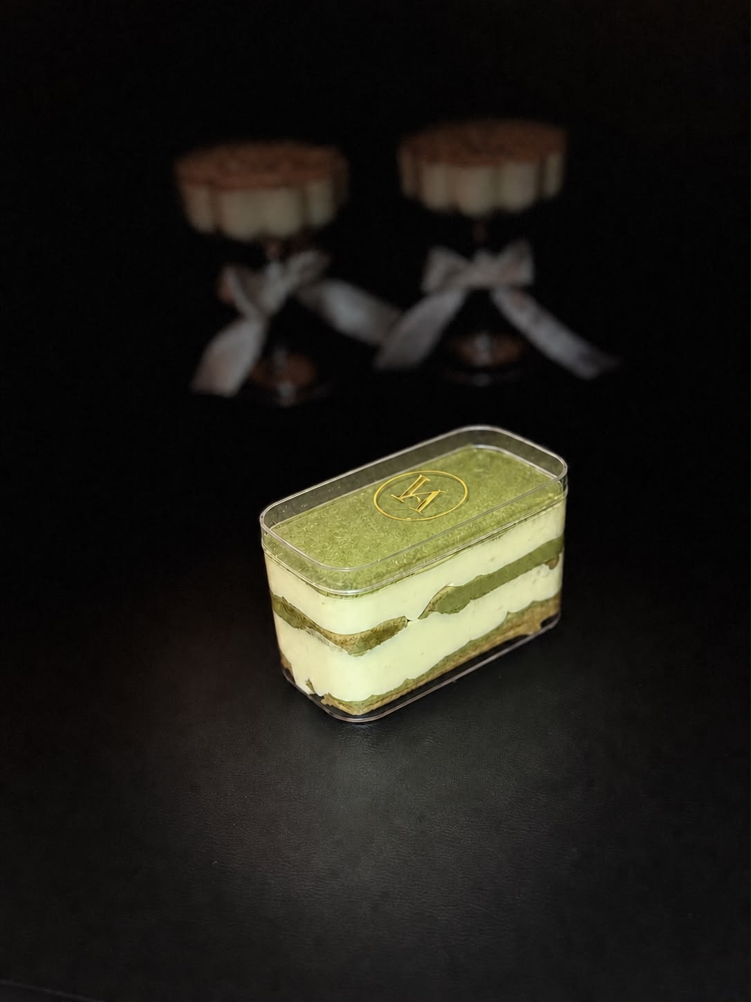 Velvet Moss matcha tiramisu in a clear Velaura tub