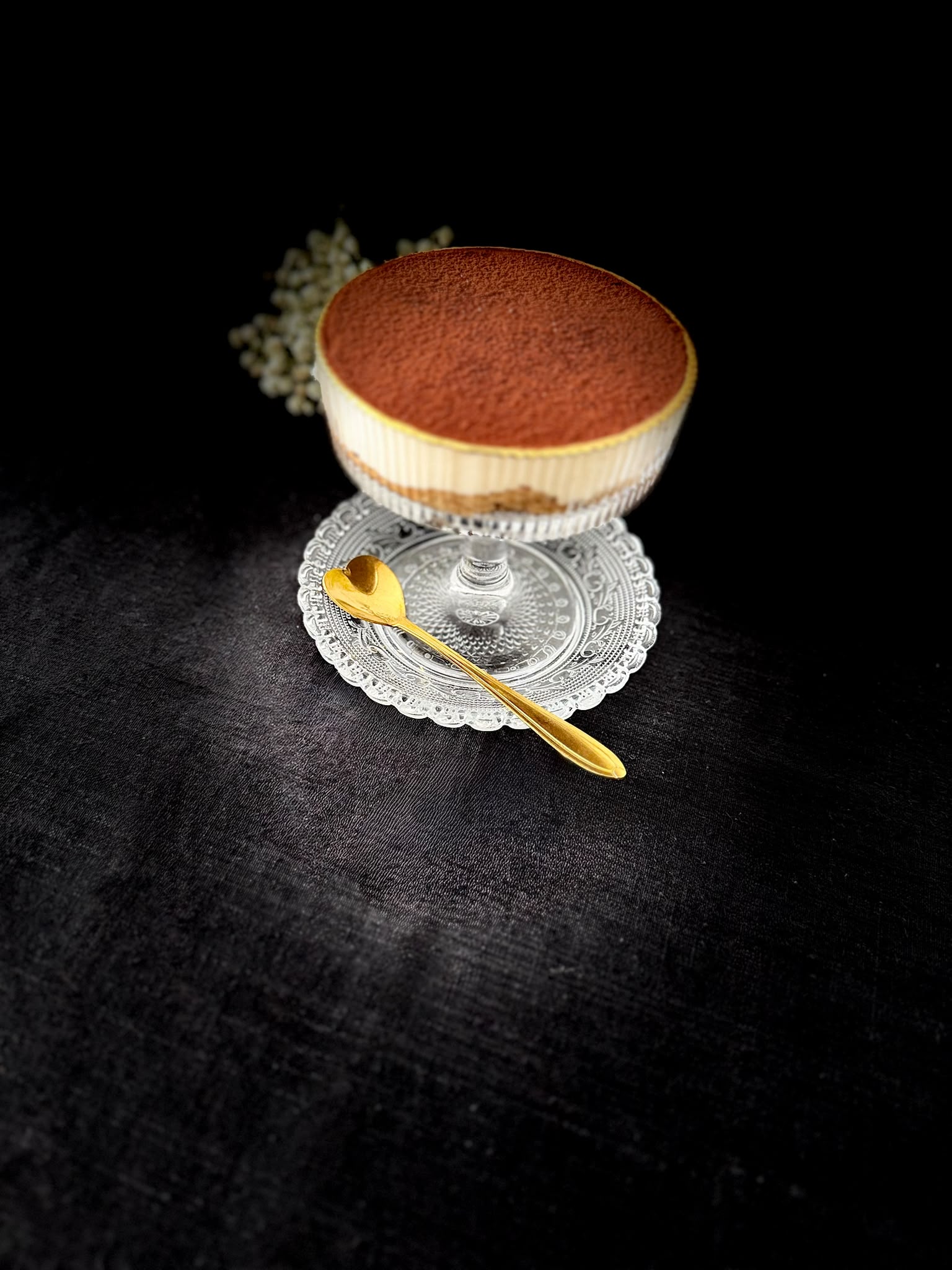 Velaura dessert served in a coupe with a gold spoon